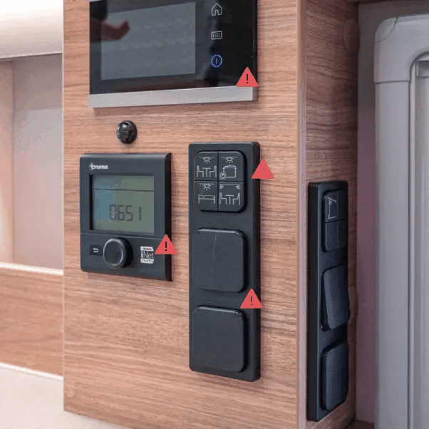 Traditional Camper van control panel with many buttons and screens
